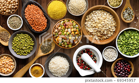 Various colorful legumes and cereals food theme background Various colorful legumes and cereals food theme background 69345957