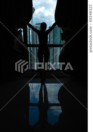 The girl accidentally fell asleep in bed at noon 69346325