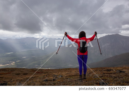 Adventurous Girl Hiking on the Mountain 69347077