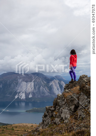 Adventurous Girl Hiking on the Mountain 69347078