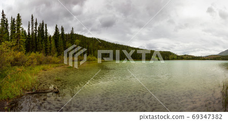Beautiful View of Lewes Lake during a cloudy summer day. Beautiful View of Lewes Lake during a cloudy summer day. 69347382