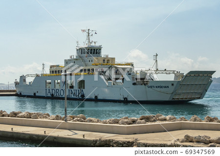 Ferry sailing between Orebic and Korcula island.  69347569