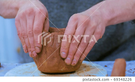 Professional male potter making ceramic jug Professional male potter making ceramic jug 69348226