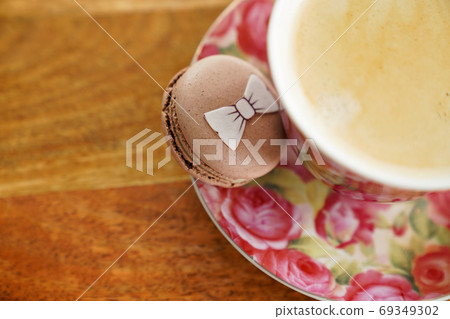 Cup coffee and macaroon on wooden Board view top 69349302