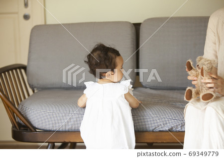 Parent and child playing in the living room Parent and child playing in the living room 69349779