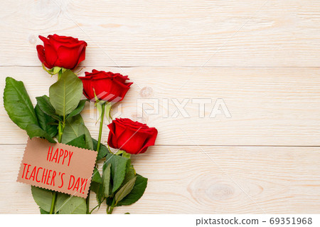 happy teacher's day, red roses with greetings on craft paper car 69351968
