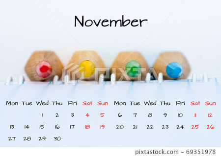 november calendar with colorful pencils background 69351978