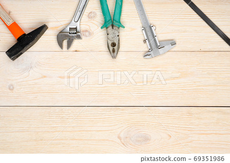 hand tools on wooden planks 69351986