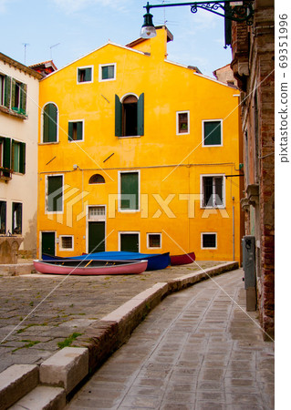 yellow house and inner court with boats in Venice yellow house and inner court with boats in Venice 69351996