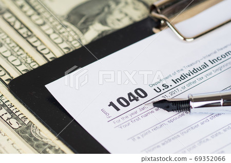 individual income tax return form 1040 with dollars banknotes ba individual income tax return form 1040 with dollars banknotes ba 69352066