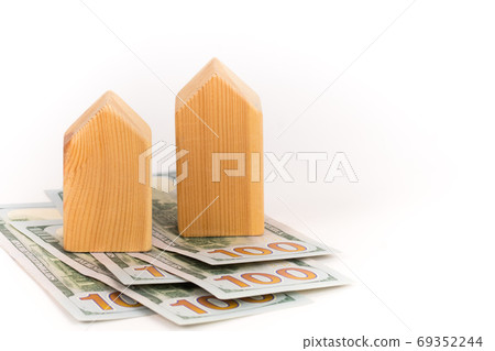wooden house model with dollars banknotes, realty expensive cost concept wooden house model with dollars banknotes, realty expensive cost concept 69352244