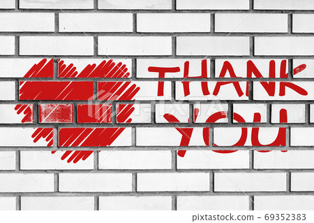 thank you phrase and red heart painted on bricks wall thank you phrase and red heart painted on bricks wall 69352383
