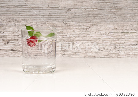 refreshment or detox water with mint and raspberry in high glass refreshment or detox water with mint and raspberry in high glass 69352386
