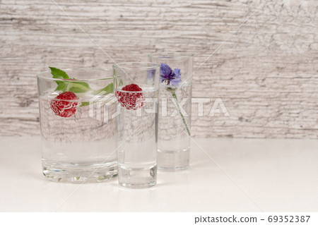 refreshment or detox water with mint and raspberry in high glass refreshment or detox water with mint and raspberry in high glass 69352387