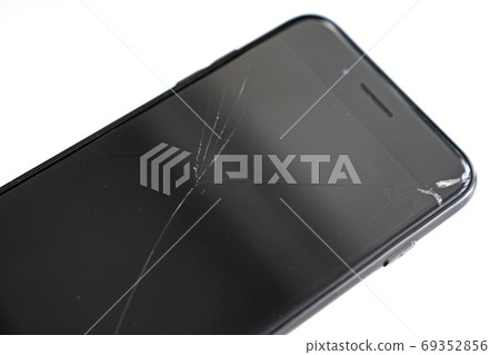 broken safety glass on the black phone. white. broken safety glass on the black phone. white. 69352856