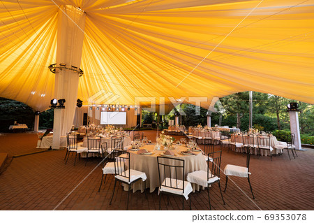 tables in outdoor tent day. Wedding decor. tables in outdoor tent day. Wedding decor. 69353078