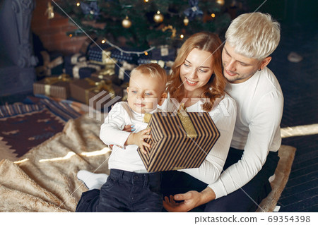 Family with little son at home near christmas tree 69354398