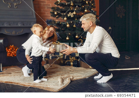 Family with little son at home near christmas tree 69354471