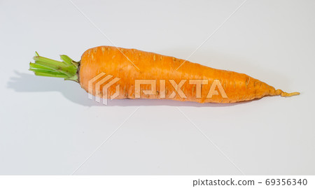 Large, fresh carrot isolated on a white background 69356340