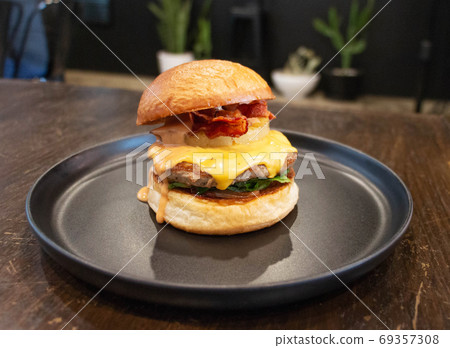 bacon cheese burger on table in restaurant bacon cheese burger on table in restaurant 69357308