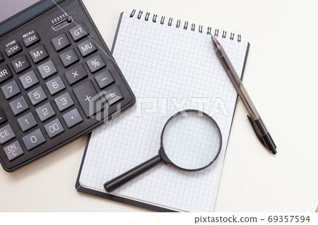 Blank notebook with pen and calculator on whitetable, business concept 69357594