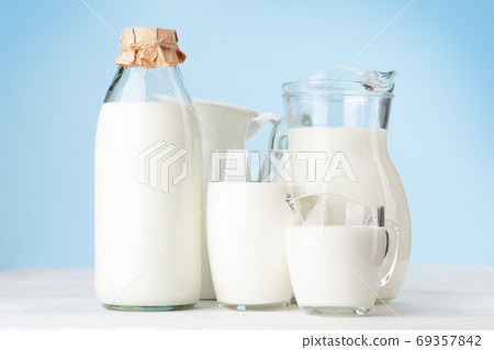 Milk in glass, bottle and jug 69357842