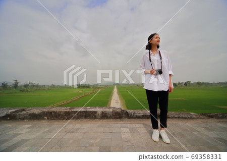 Young woman traveling on the walls of Hu Dynasty Young woman traveling on the walls of Hu Dynasty 69358331
