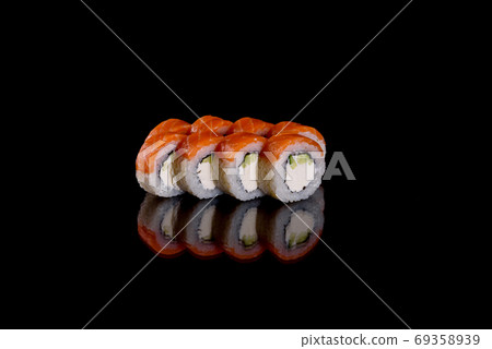 Fresh delicious beautiful sushi rolls on a dark background 69358939