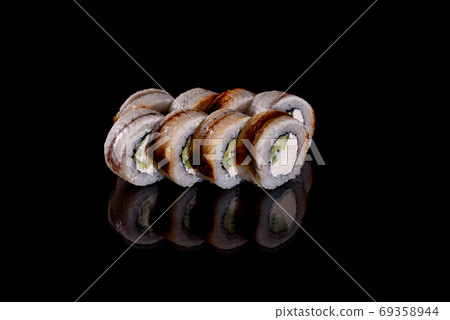 Fresh delicious beautiful sushi rolls on a dark background Fresh delicious beautiful sushi rolls on a dark background 69358944