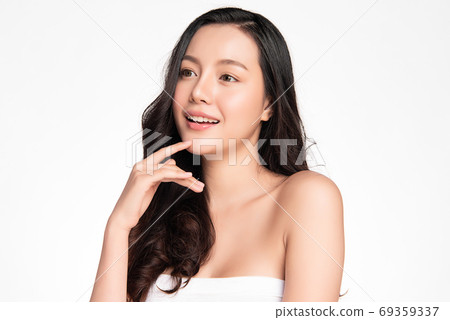 Beautiful young asian woman with clean fresh skin on white background, Face care, Facial treatment 69359337