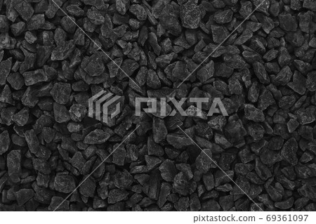 Close up of black grey gravel in the garden, natural small stones texture for background and design art work. 69361097
