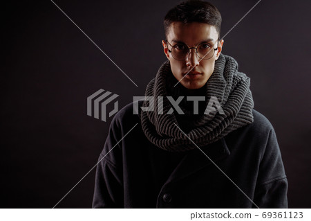Portrait of handsome stylish man in coat with watch Portrait of handsome stylish man in coat with watch 69361123