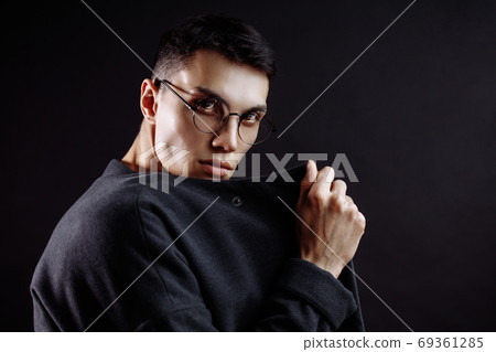 closeup portrait of handsome caucasian brunette on black closeup portrait of handsome caucasian brunette on black 69361285