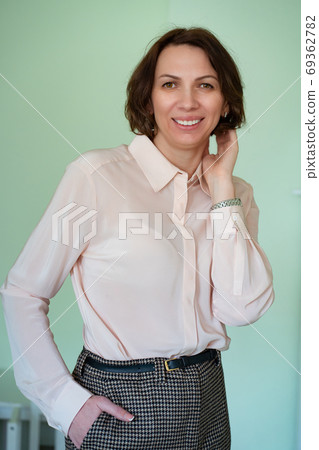 business portrait of an adult woman with dark hair business portrait of an adult woman with dark hair 69362782