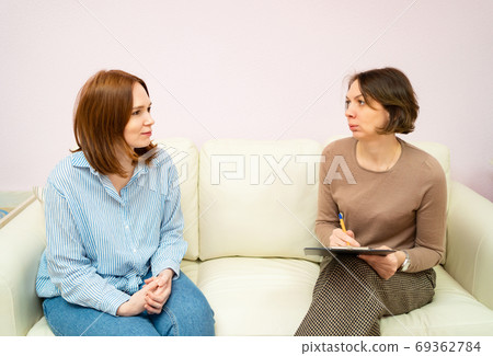 woman in the psychologist office for counseling. woman in the psychologist office for counseling. 69362784
