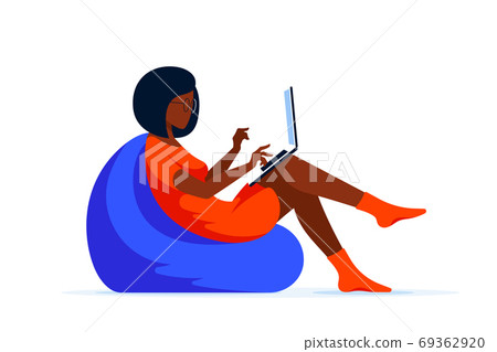 Young woman with laptop sitting in chair bag 69362920