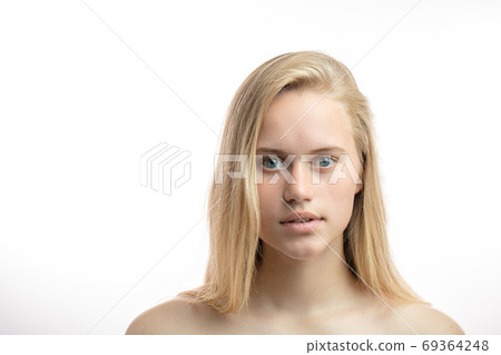 Headshot of naked blonde caucasian young woman looking at camera. Headshot of naked blonde caucasian young woman looking at camera. 69364248