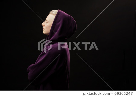 Sports fashion concept. Albino guy posing in sporty clothing isolated over black background. 69365247