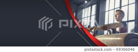 Little male athlete training hard in the gym. Fitness and healthy lifestyle concept. Flyer with copyspace. 69366046