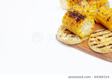 grilled corn vegetables on a white background, copy space, flatlay grilled corn vegetables on a white background, copy space, flatlay 69366324