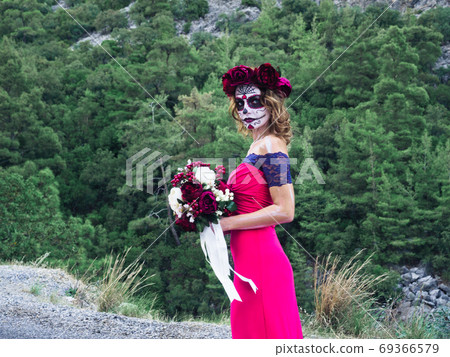 Halloween makeup woman of Santa Muerte outdoors Halloween makeup woman of Santa Muerte outdoors 69366579