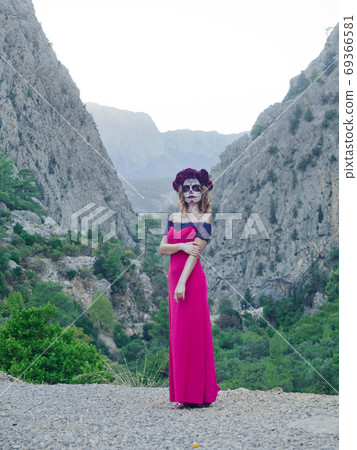 Halloween makeup woman of Santa Muerte outdoors Halloween makeup woman of Santa Muerte outdoors 69366581