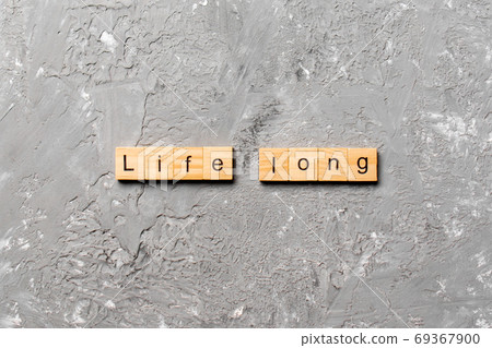 life long word written on wood block. life long text on table, concept 69367900