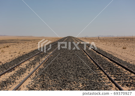 Abandoned and forgotten railway being taken over by encroaching sandstorm, Kolmanskop ghost town, Namib Desert. Africa 69370927
