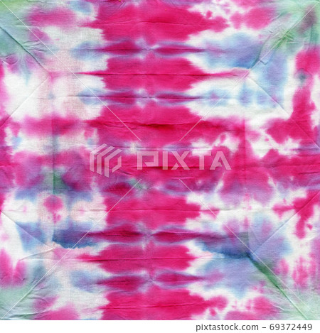 Tie dyed pattern on cotton fabric for background. 69372449