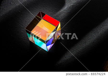 Colorful bright glass prism cube  Refracting light in vivid rain 69374224