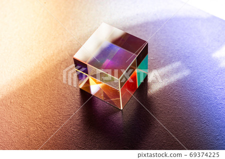 Colorful bright glass prism cube  Refracting light in vivid rain 69374225