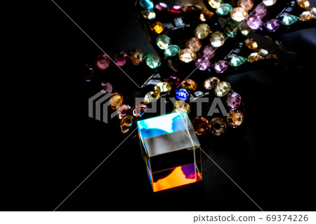 Colorful bright glass prism cube Refracting light in vivid rain Colorful bright glass prism cube Refracting light in vivid rain 69374226