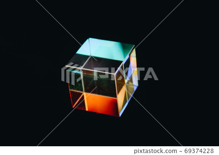 Colorful bright glass prism cube Refracting light in vivid rain Colorful bright glass prism cube Refracting light in vivid rain 69374228