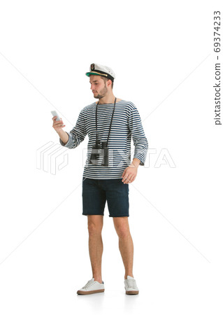 Caucasian male sailor in uniform isolated on white studio background Caucasian male sailor in uniform isolated on white studio background 69374233